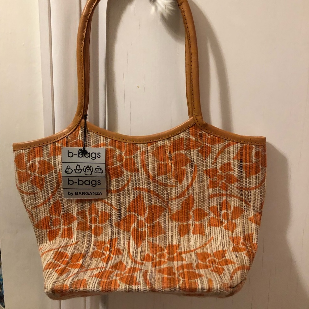 Orange and tan flowered woven shoulder bag